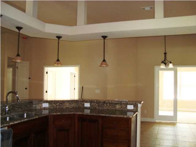 3056 Wallace Lake Road Pace, FL 32571 - Photo 5 of 19 a bathroom with a granite countertop sink a window and a mirror
