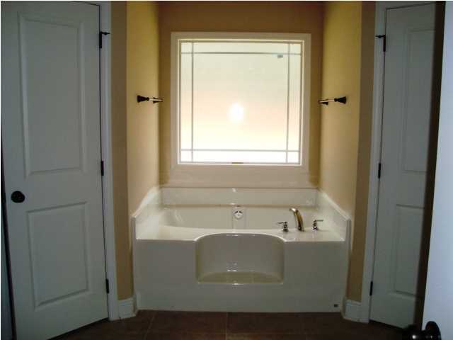 3056 Wallace Lake Road Pace, FL 32571 - Photo 9 of 19 a bathroom with a sink and a window