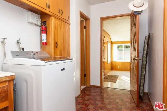 a bedroom with a bed chair and a window