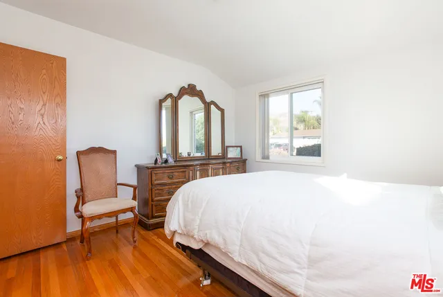 a bathroom with a bathtub sink and mirror