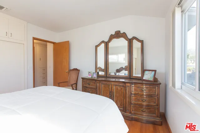 a bathroom with a white bath tub and a shower curtain