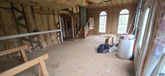 a view of a room with large windows