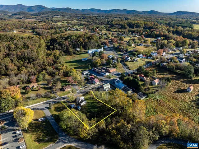 an aerial view of residential houses and outdoor space