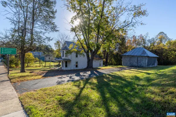 a view of house with a garden