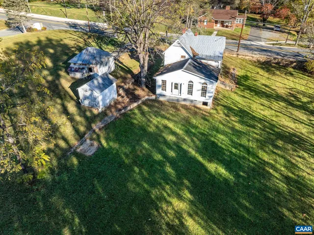 an aerial view of residential houses and outdoor space