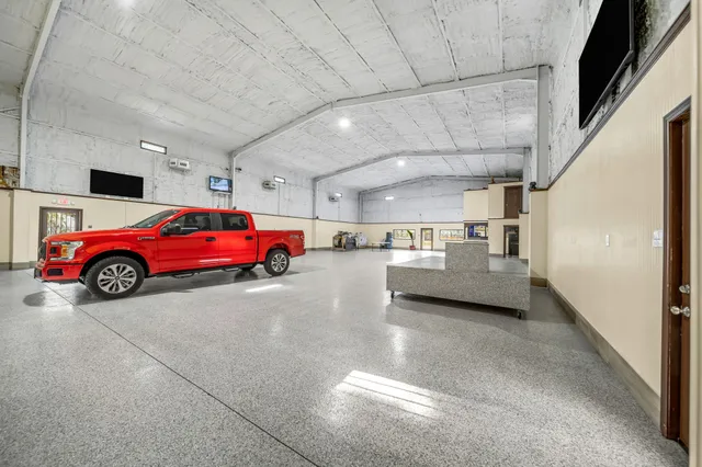 a kitchen with a sink and a large window