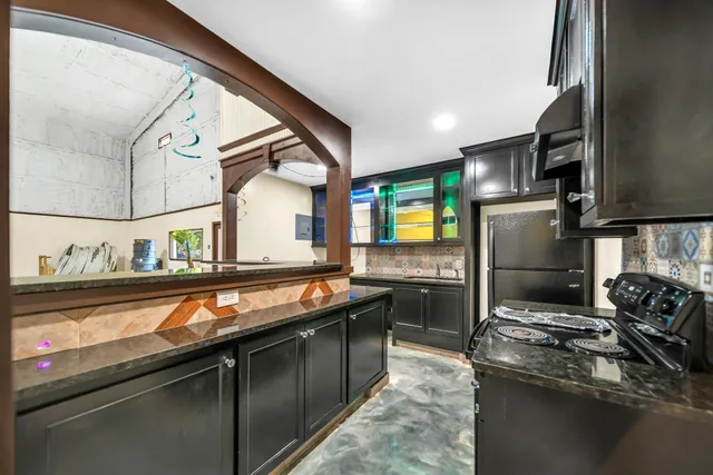 a bathroom with double vanity sinks and a mirror