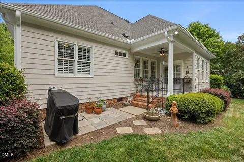 a view of a patio with table and chairs with wooden floor