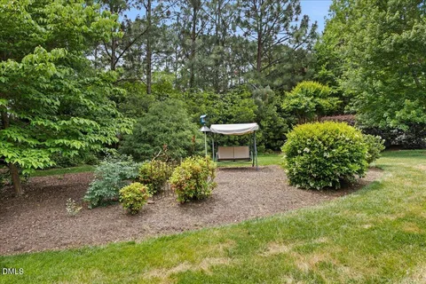 a backyard of a house with outdoor seating
