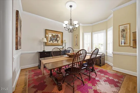 a kitchen with stainless steel appliances granite countertop a stove cabinets and wooden floor