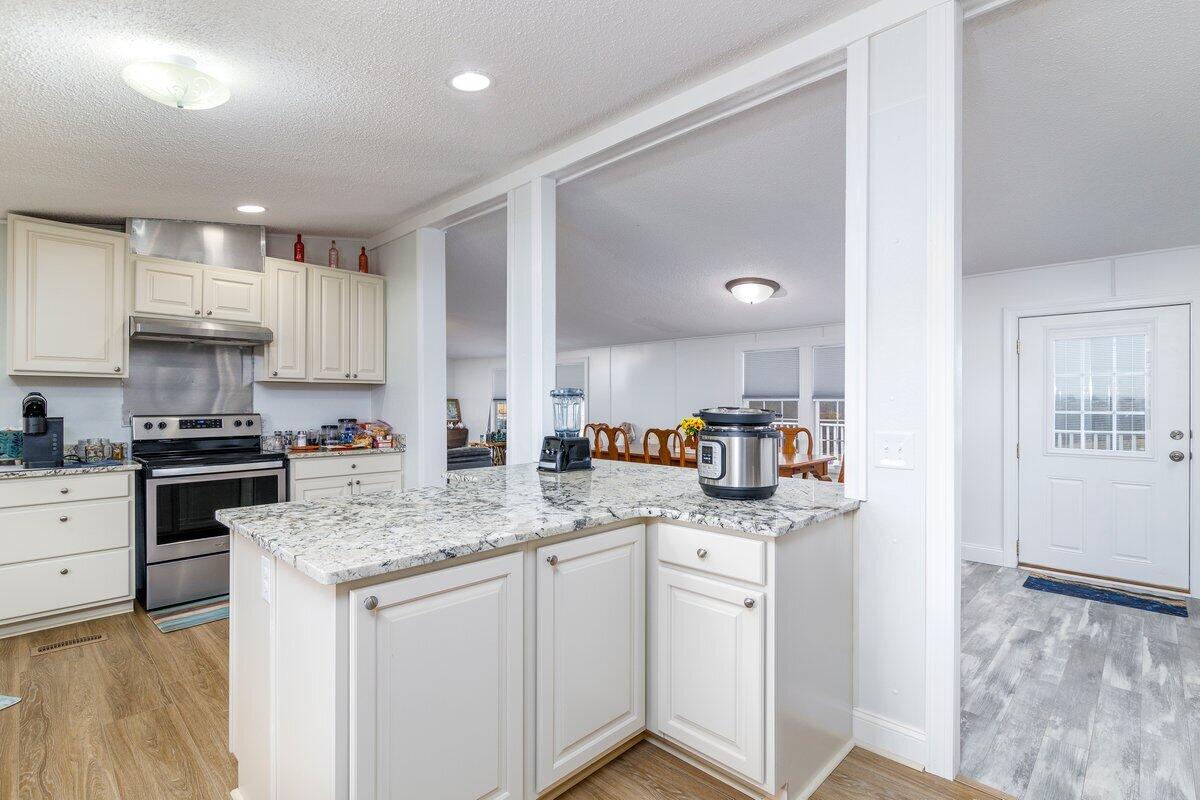 652 Marcus-823 Road Rocky Mount, VA 24151 - Photo 13 of 34 a kitchen with granite countertop cabinets stainless steel appliances and a counter space