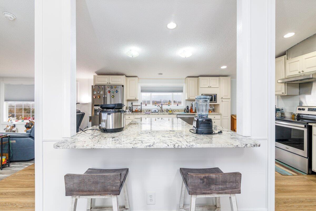 652 Marcus-823 Road Rocky Mount, VA 24151 - Photo 23 of 34 a kitchen with refrigerator and chairs