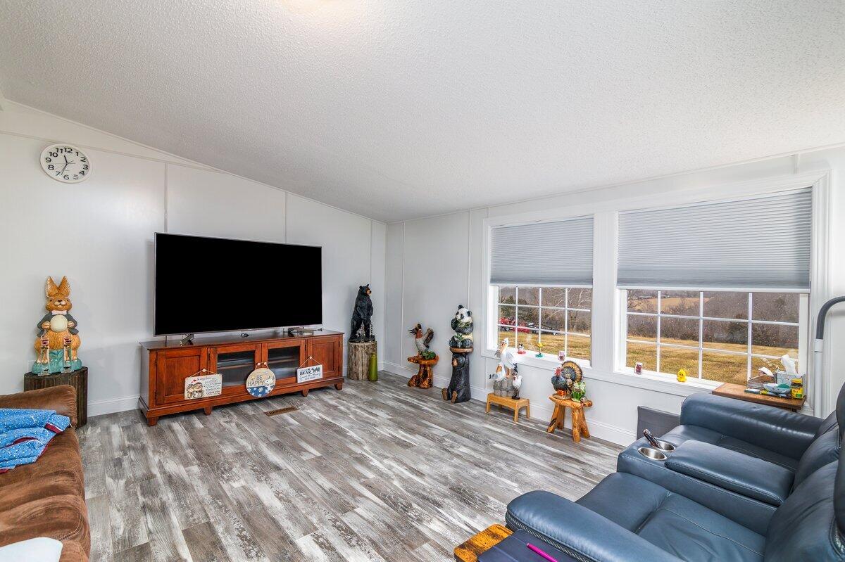 652 Marcus-823 Road Rocky Mount, VA 24151 - Photo 25 of 34 a living room with furniture and a flat screen tv