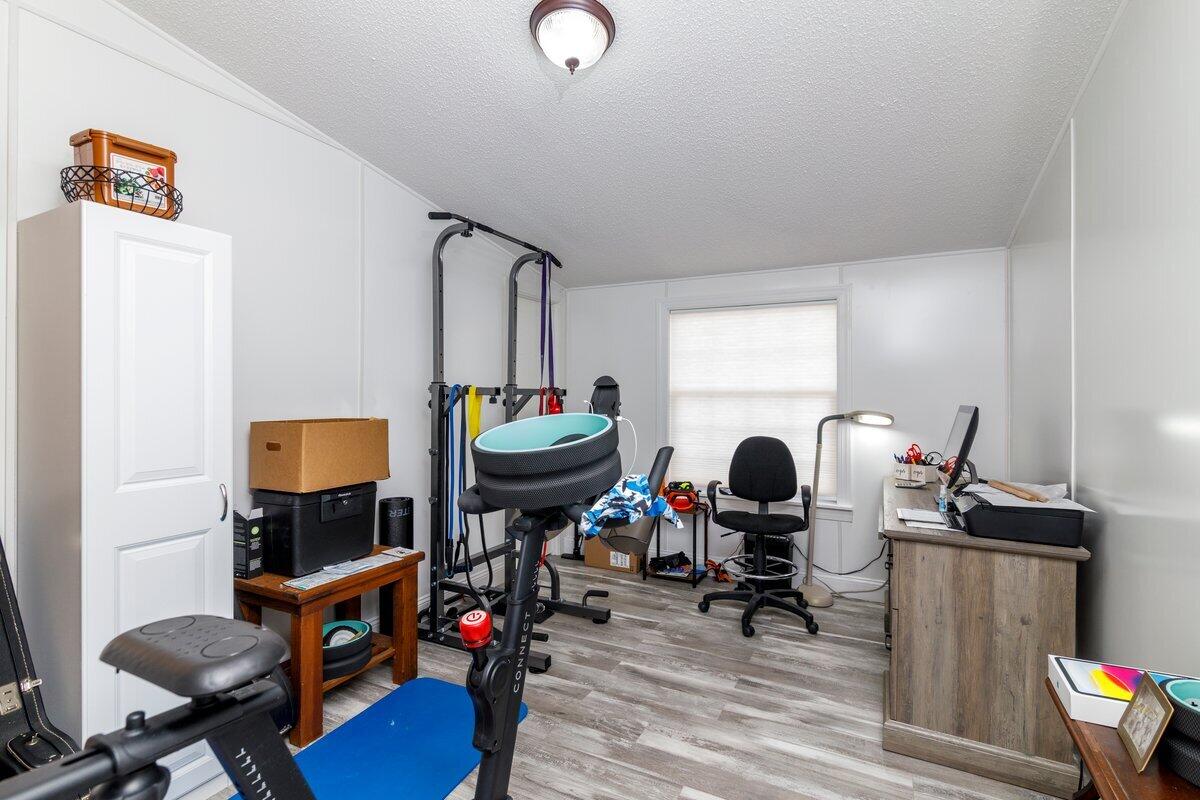 652 Marcus-823 Road Rocky Mount, VA 24151 - Photo 27 of 34 a work room with furniture and wooden floor