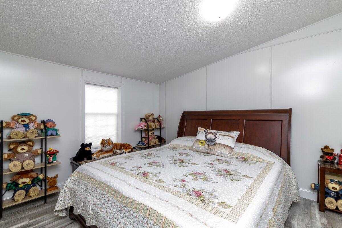 652 Marcus-823 Road Rocky Mount, VA 24151 - Photo 29 of 34 a bed sitting in a bedroom next to a window