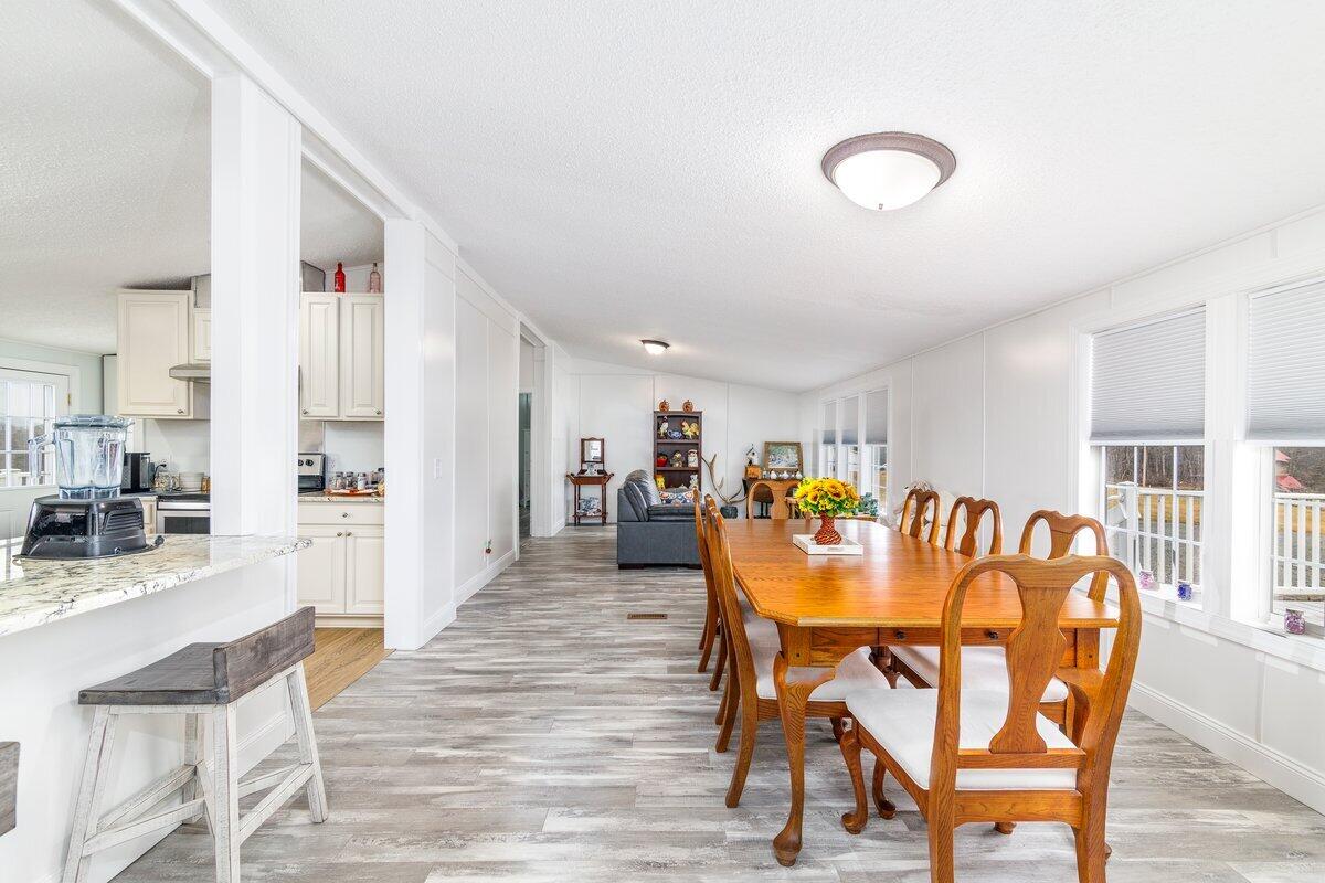 652 Marcus-823 Road Rocky Mount, VA 24151 - Photo 7 of 34 a dining room with furniture and wooden floor