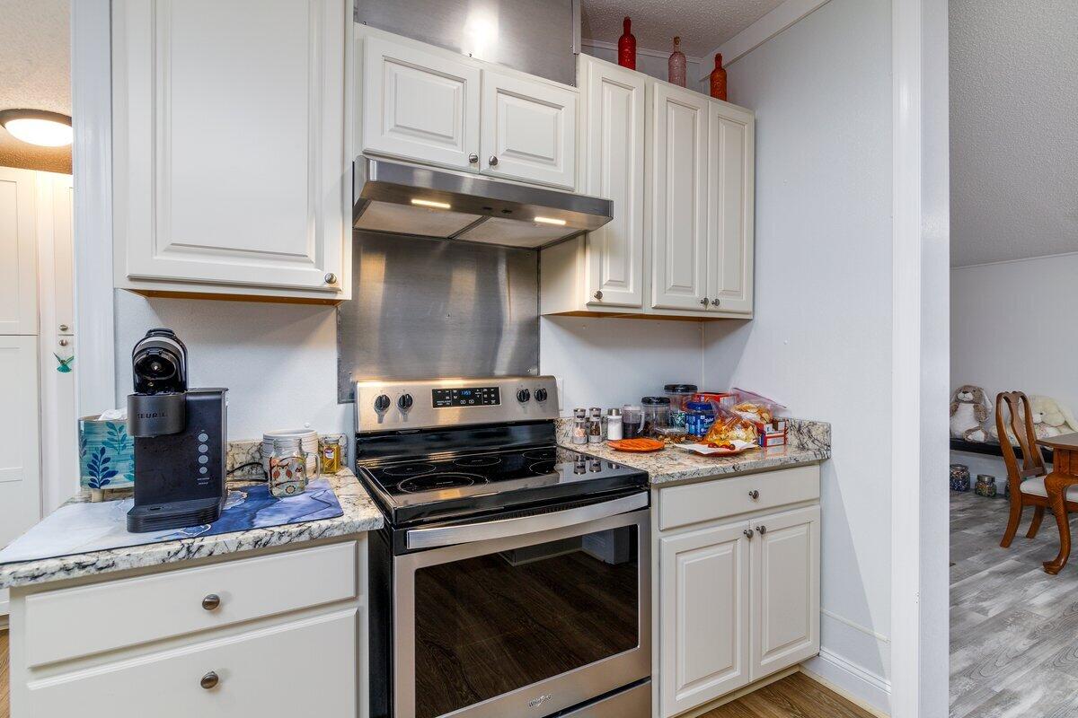 652 Marcus-823 Road Rocky Mount, VA 24151 - Photo 10 of 34 a kitchen with stainless steel appliances granite countertop a stove and cabinets