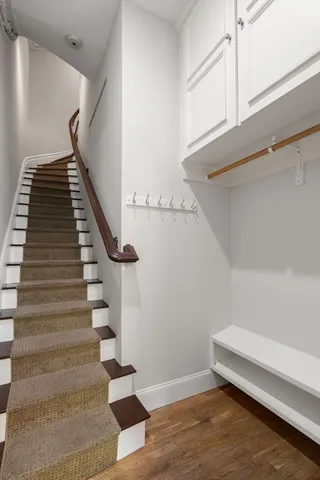 front view of a house with a tree