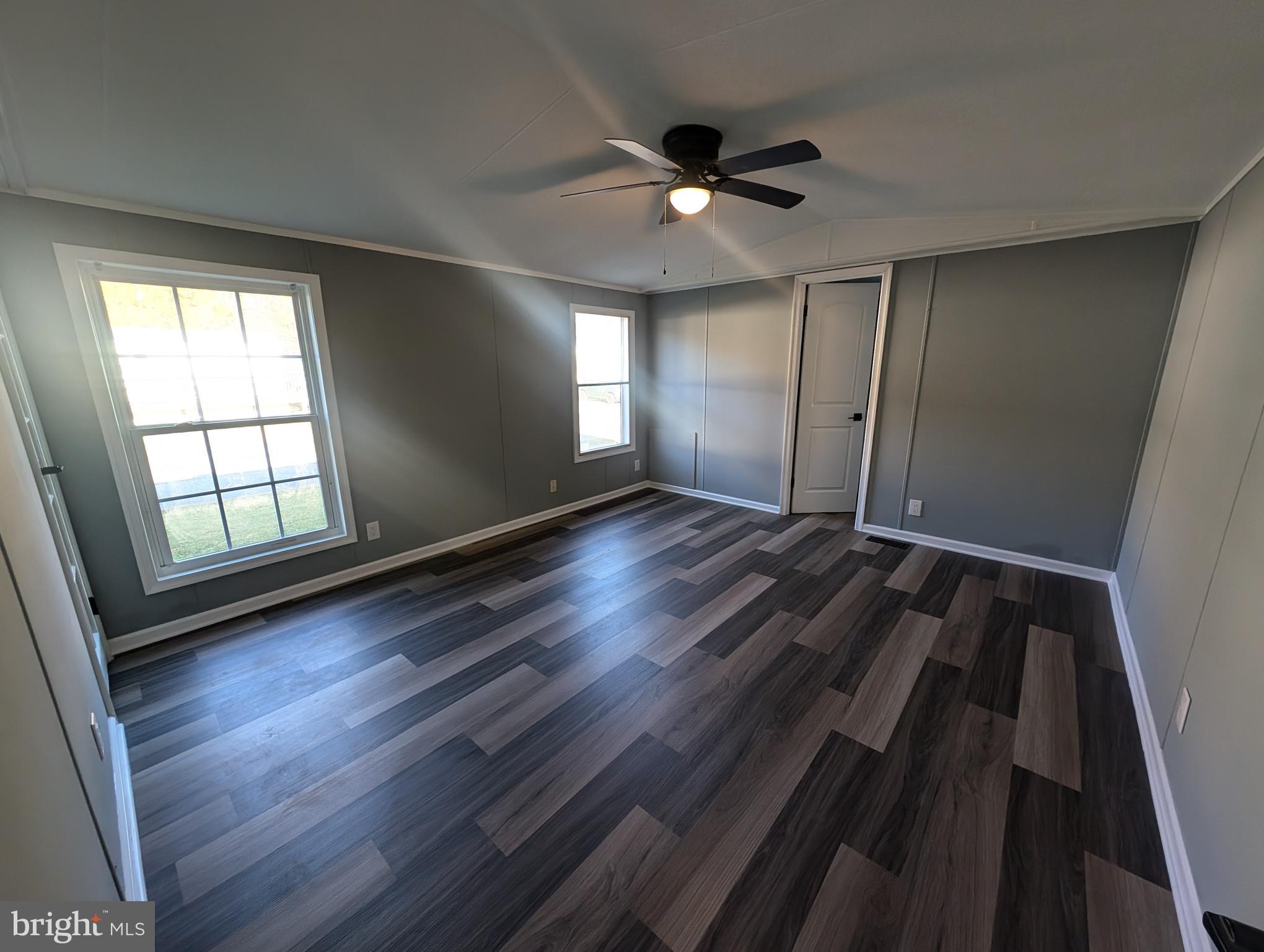 230 Poclain Road Aberdeen, MD 21001 - Photo 3 of 10 wooden floor in an empty room with a window