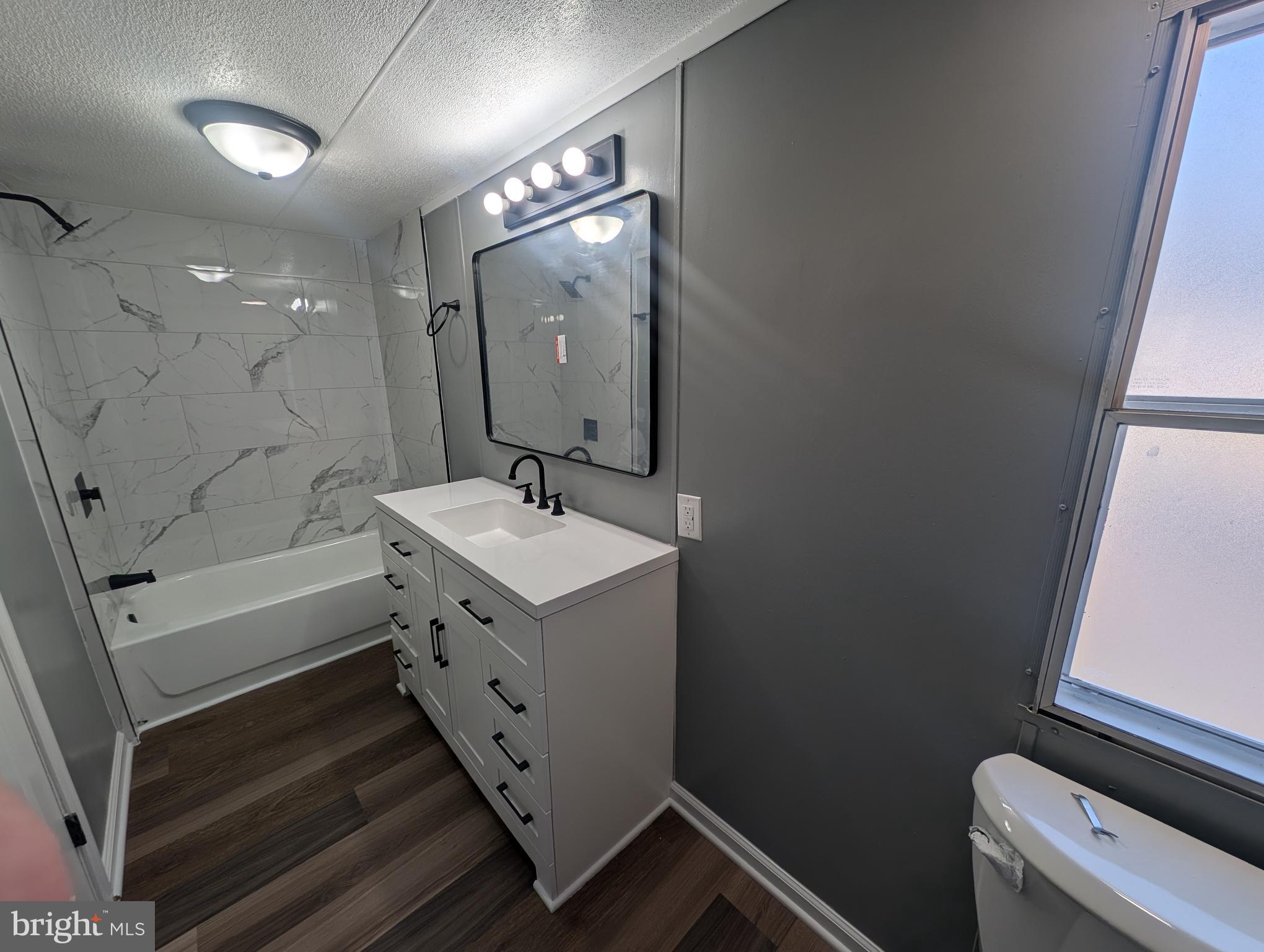 230 Poclain Road Aberdeen, MD 21001 - Photo 4 of 10 a bathroom with a sink a toilet and shower