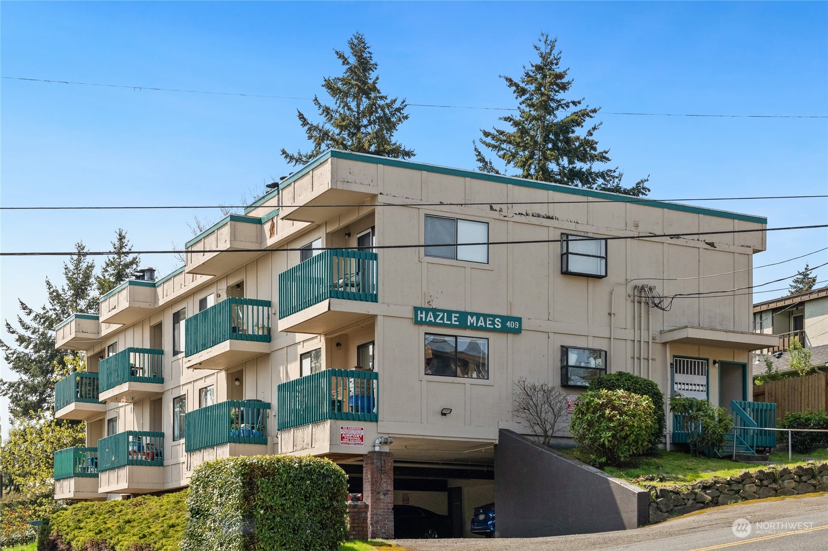 a front view of a building with garden