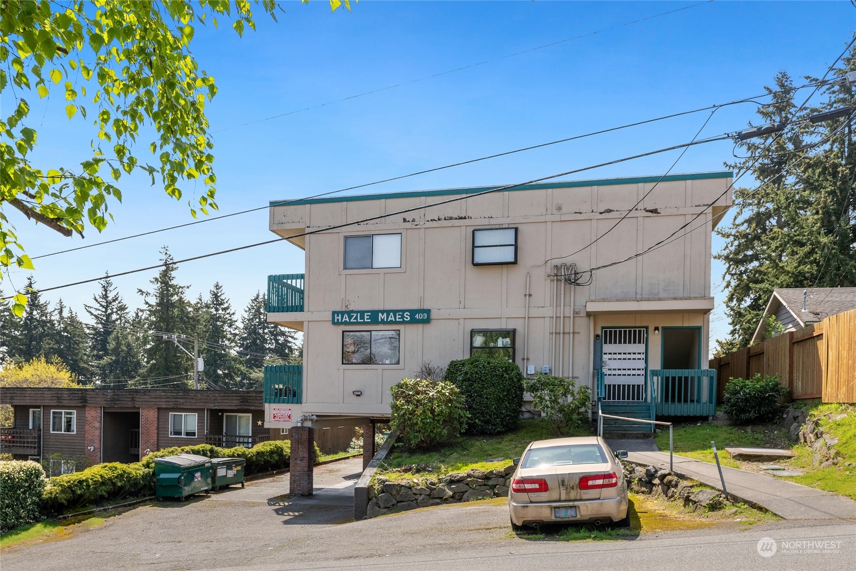 409 Southwest 155th Street Burien, WA 98166 - Photo 11 of 22 a car parked in front of a house