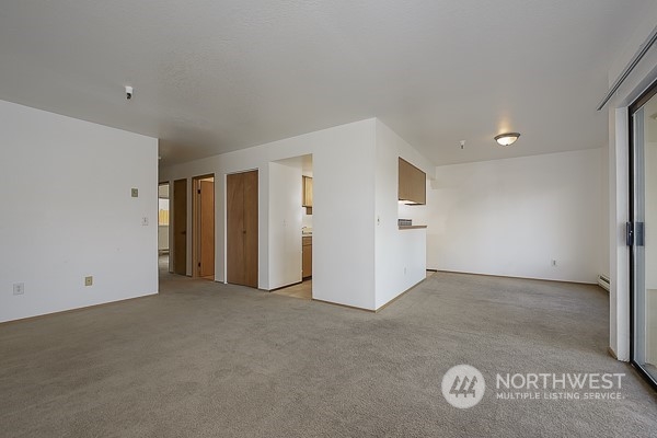 409 Southwest 155th Street Burien, WA 98166 - Photo 19 of 22 an empty room with closet and mirror