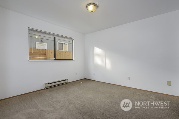409 Southwest 155th Street Burien, WA 98166 - Photo 20 of 22 an empty room with a window