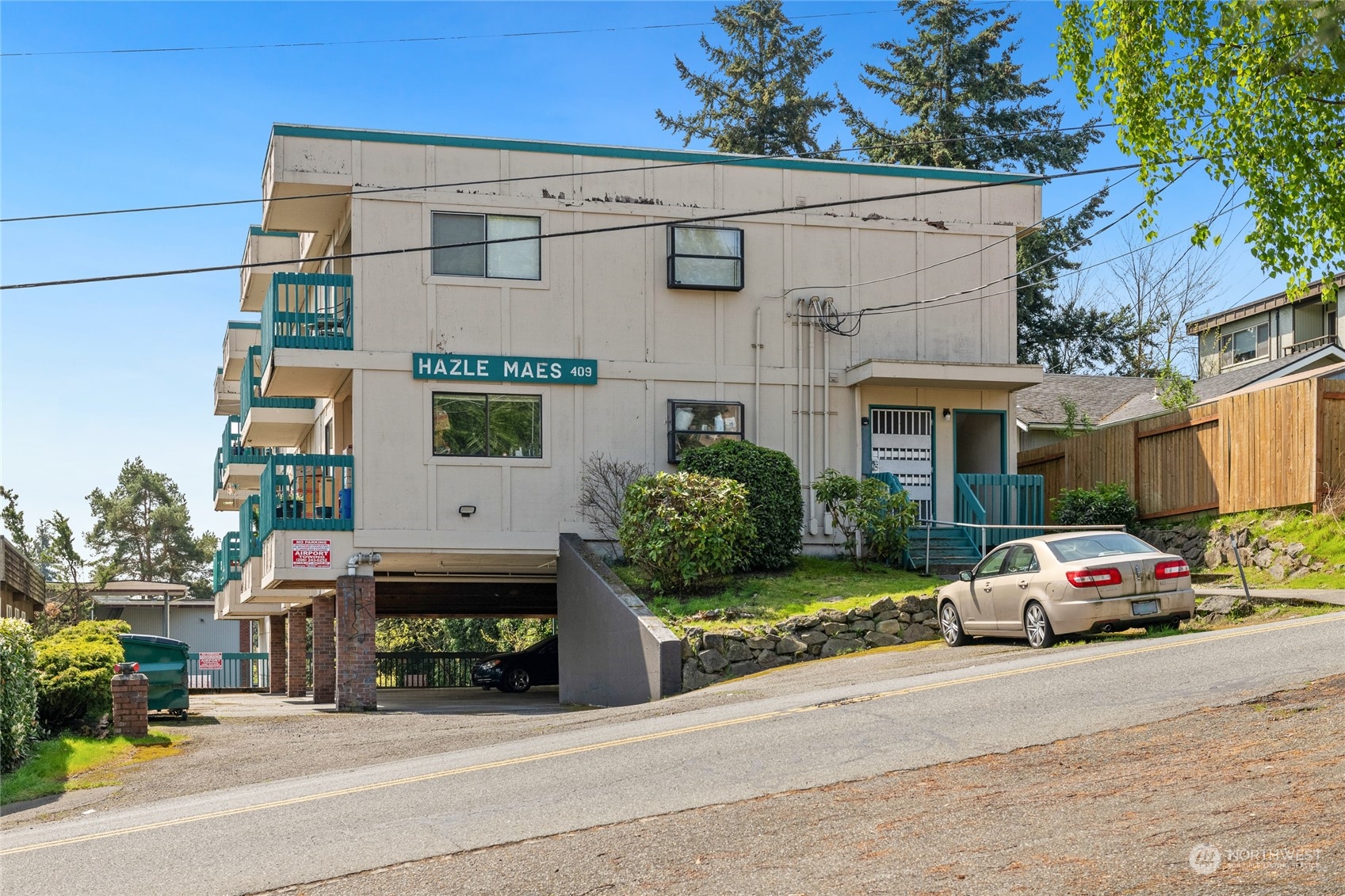 409 Southwest 155th Street Burien, WA 98166 - Photo 2 of 22 a car parked in front of a building