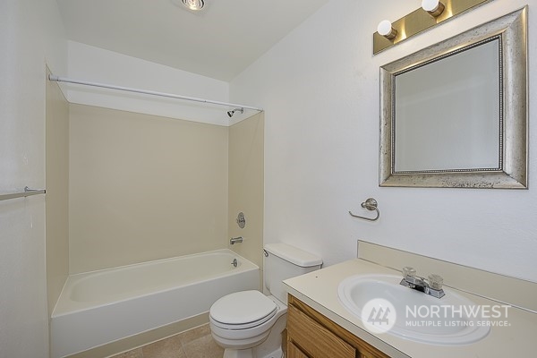 409 Southwest 155th Street Burien, WA 98166 - Photo 22 of 22 a bathroom with a sink a toilet and shower