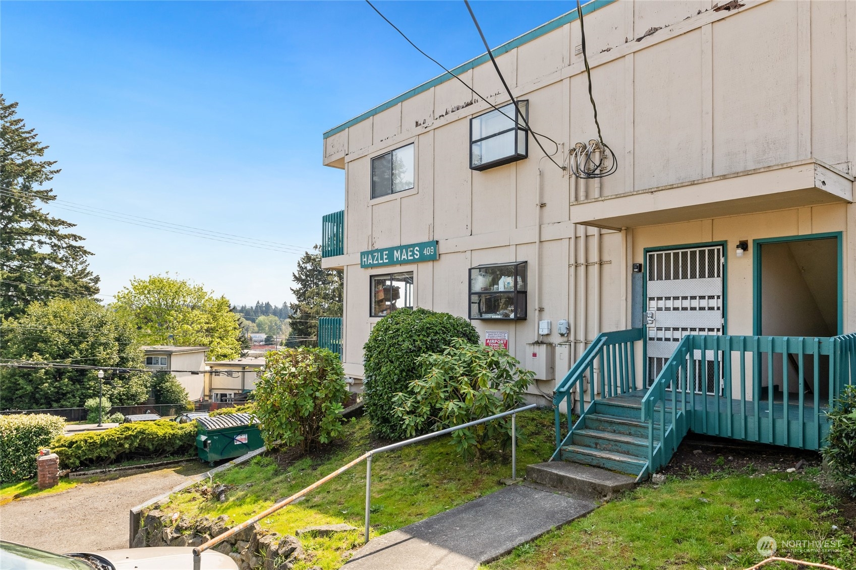 409 Southwest 155th Street Burien, WA 98166 - Photo 3 of 22 a view of a house with backyard and sitting area