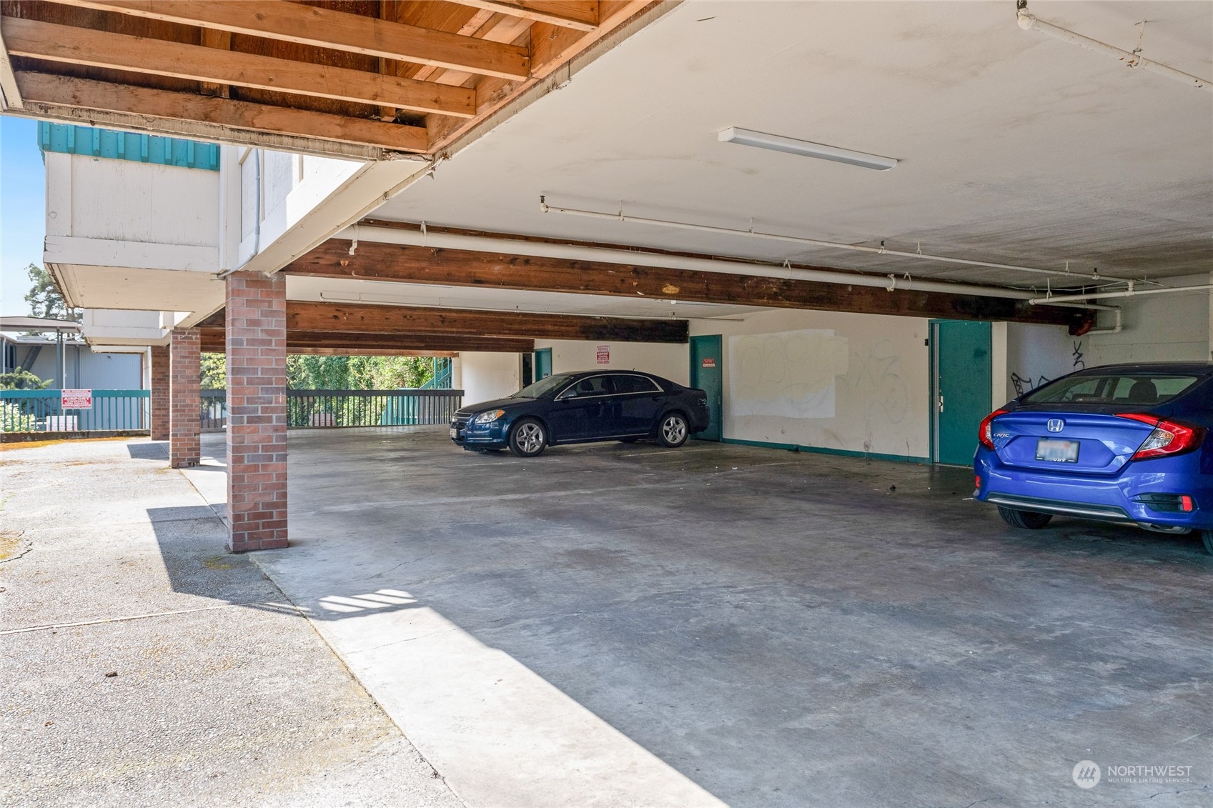 409 Southwest 155th Street Burien, WA 98166 - Photo 6 of 22 a car parked in parking