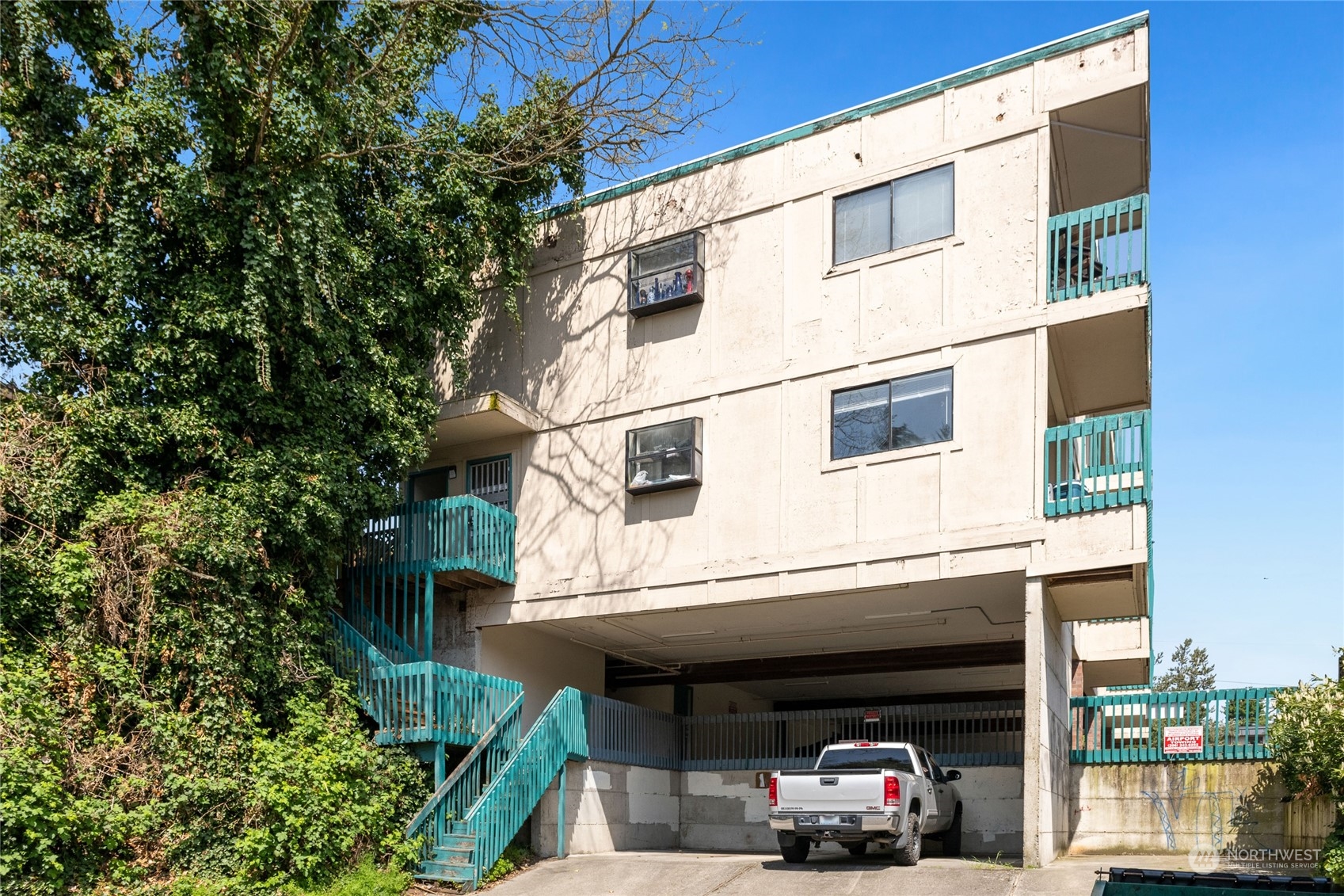 409 Southwest 155th Street Burien, WA 98166 - Photo 8 of 22 a car parked in front of a building