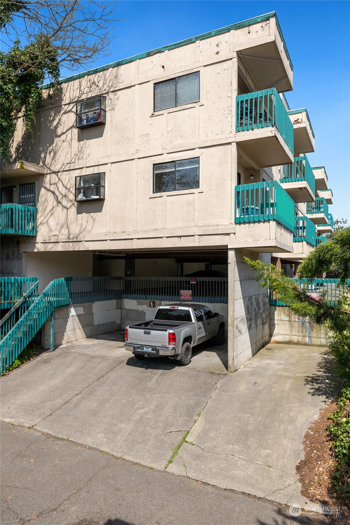 409 Southwest 155th Street Burien, WA 98166 - Photo 10 of 22 a car parked in front of white building