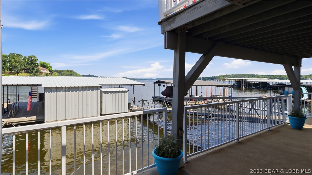 1069 Indian Hill Road Sunrise Beach, MO 65079 - Photo 37 of 54 Lower Level Patio just steps to the dock