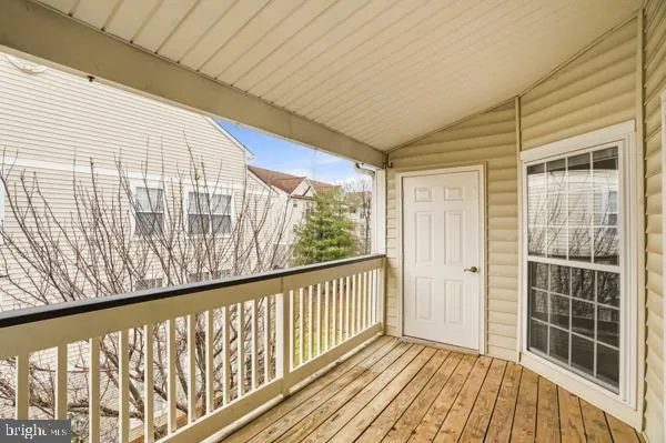 a view of balcony with wooden floor