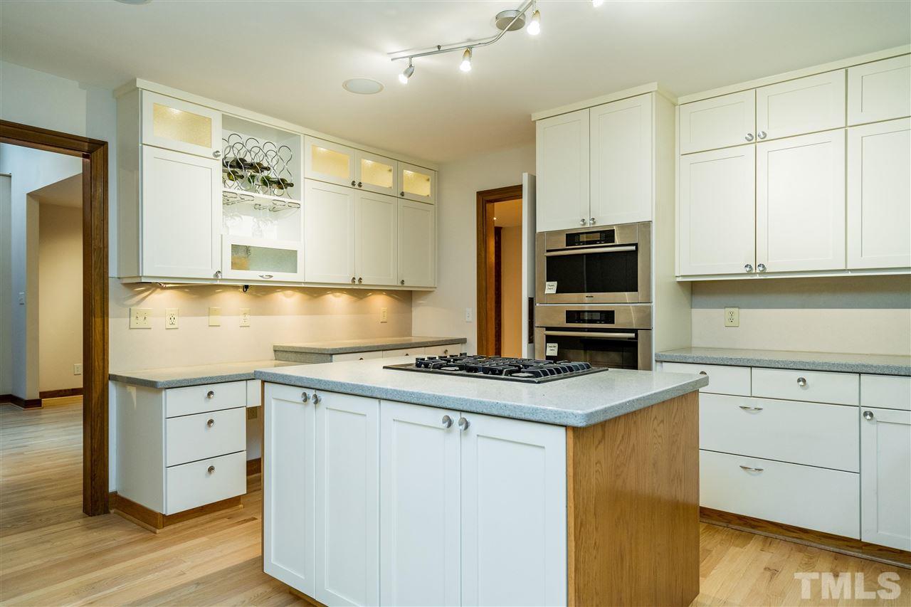 10033 Old Warden Road Raleigh, NC 27615 - Photo 18 of 30 Quartz counters, Miele appliances incl. steam & large convection ovens, professional sink, gas range, custom cabinets.