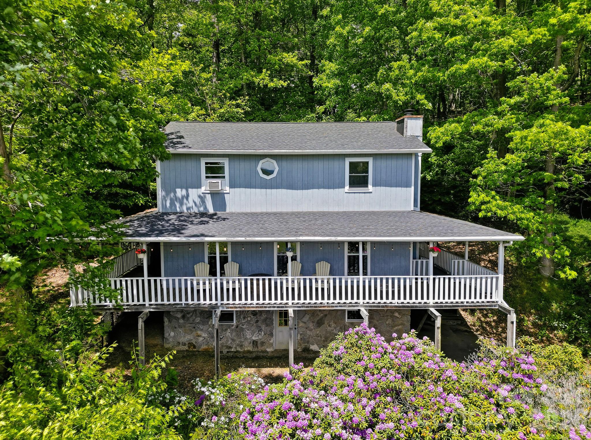 2131 Coleman Mountain Road Waynesville, NC 28785 - Photo 1 of 40 front view of a house with a deck