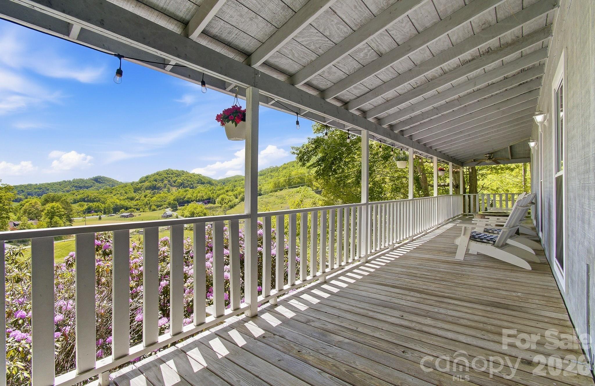 2131 Coleman Mountain Road Waynesville, NC 28785 - Photo 2 of 40 a view of balcony with wooden floor