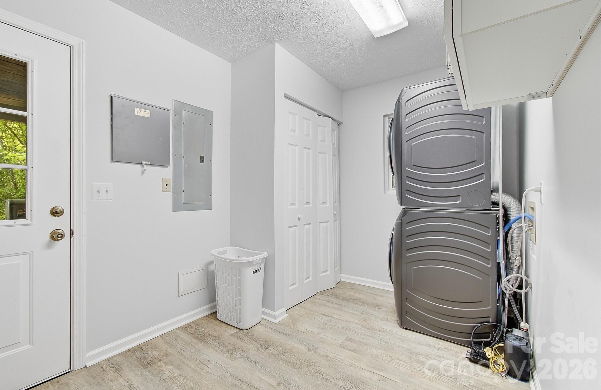 2131 Coleman Mountain Road Waynesville, NC 28785 - Photo 27 of 40 a view of a storage & utility room with washer and dryer
