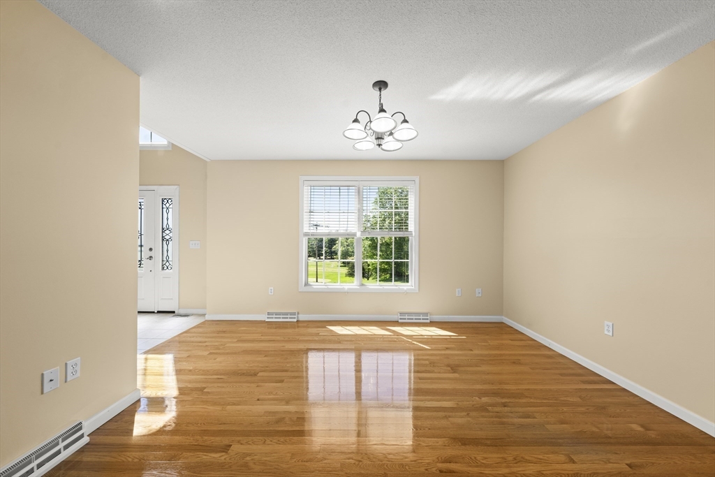 1507 East Mountain Road Westfield, MA 01085 - Photo 13 of 42 a view of an empty room with wooden floor and a window