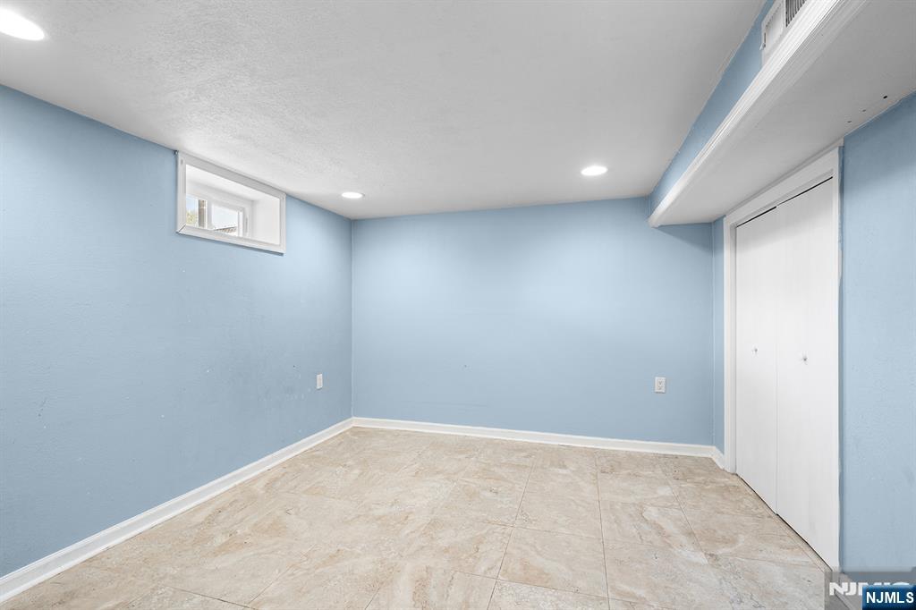 71 Wingra Avenue Rutherford, NJ 07070 - Photo 11 of 20 an empty room with windows