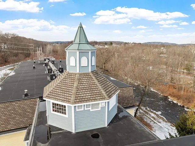 a view of a terrace with wooden floor and city view