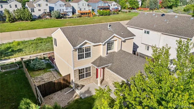 an aerial view of a house with a garden
