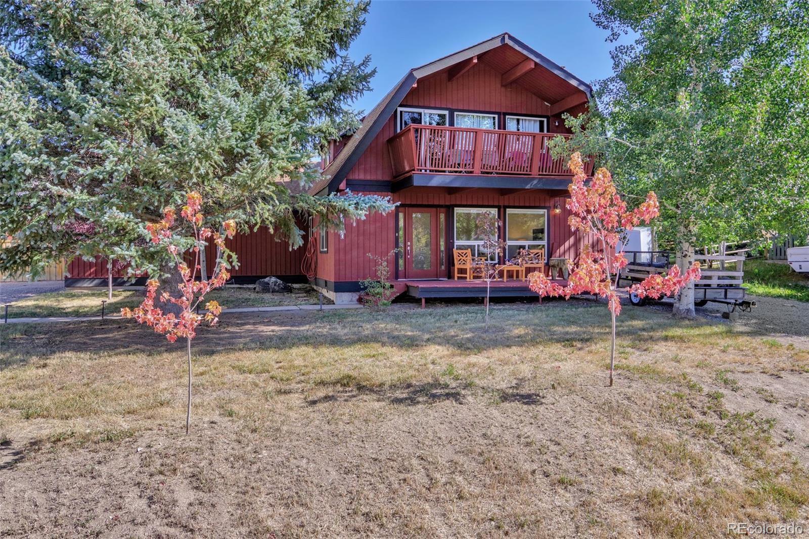 27320 Moonlight Way Steamboat Springs, CO 80487 - Photo 12 of 37 a front view of a house with garden