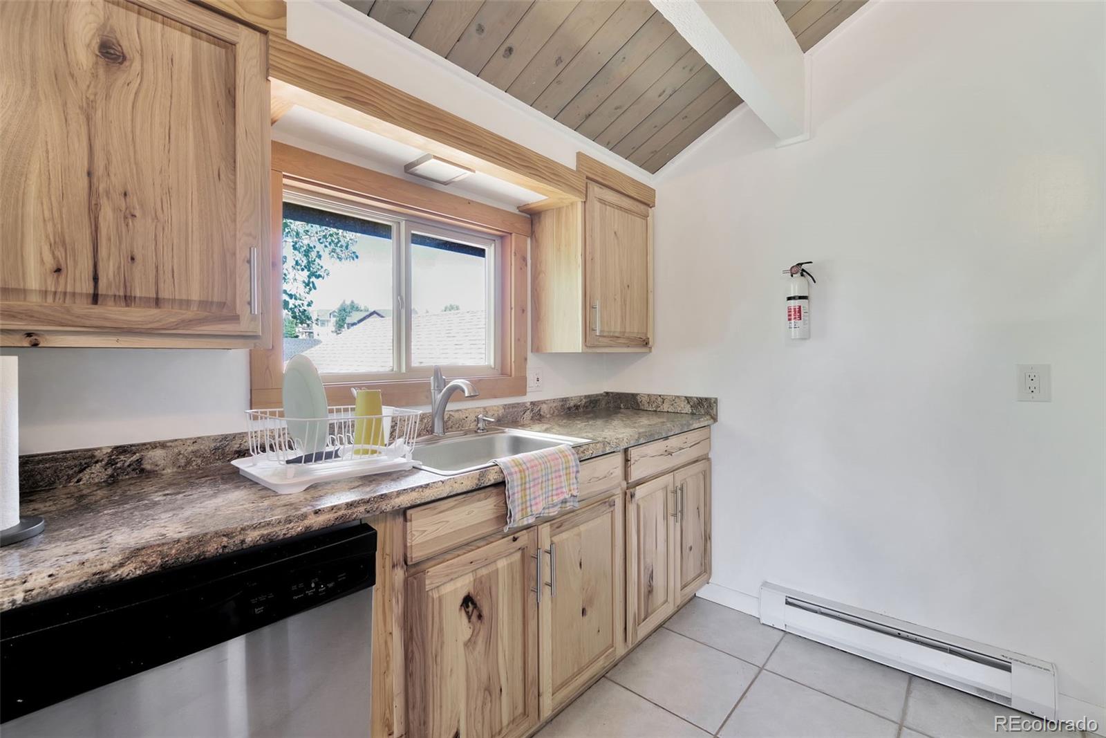 27320 Moonlight Way Steamboat Springs, CO 80487 - Photo 24 of 37 a bathroom with a granite countertop sink and a vanity