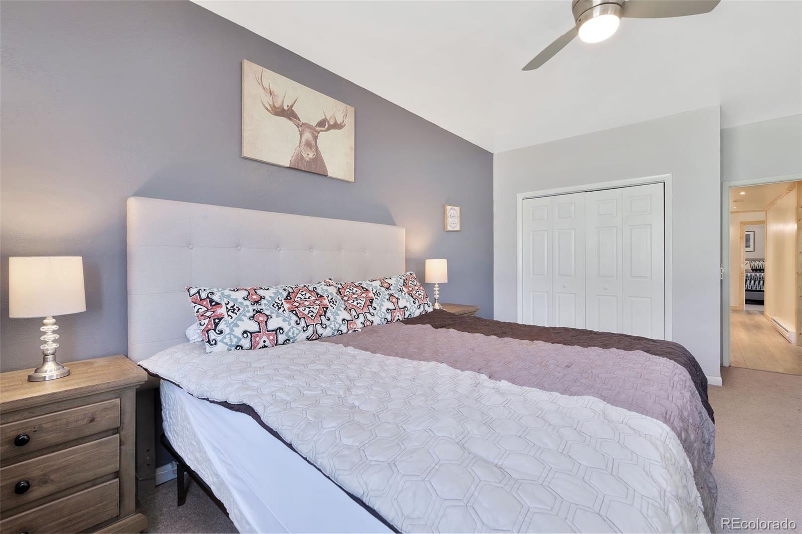 27320 Moonlight Way Steamboat Springs, CO 80487 - Photo 7 of 37 a bedroom with a bed and a lamp on dresser