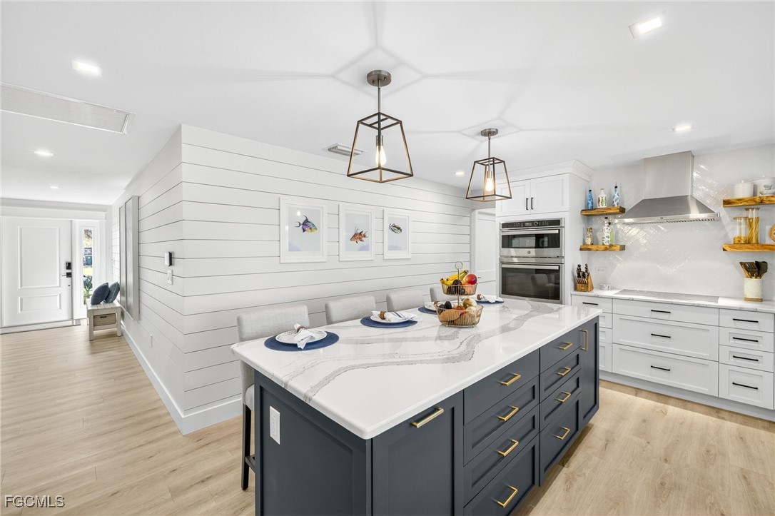 941 Pecten Court Sanibel, FL 33957 - Photo 20 of 44 a kitchen that has a sink and cabinets