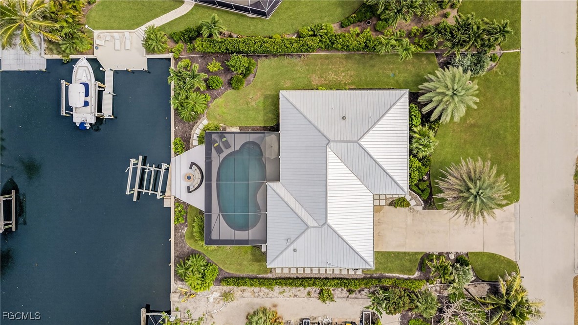 941 Pecten Court Sanibel, FL 33957 - Photo 40 of 44 an aerial view of a house with a lake view