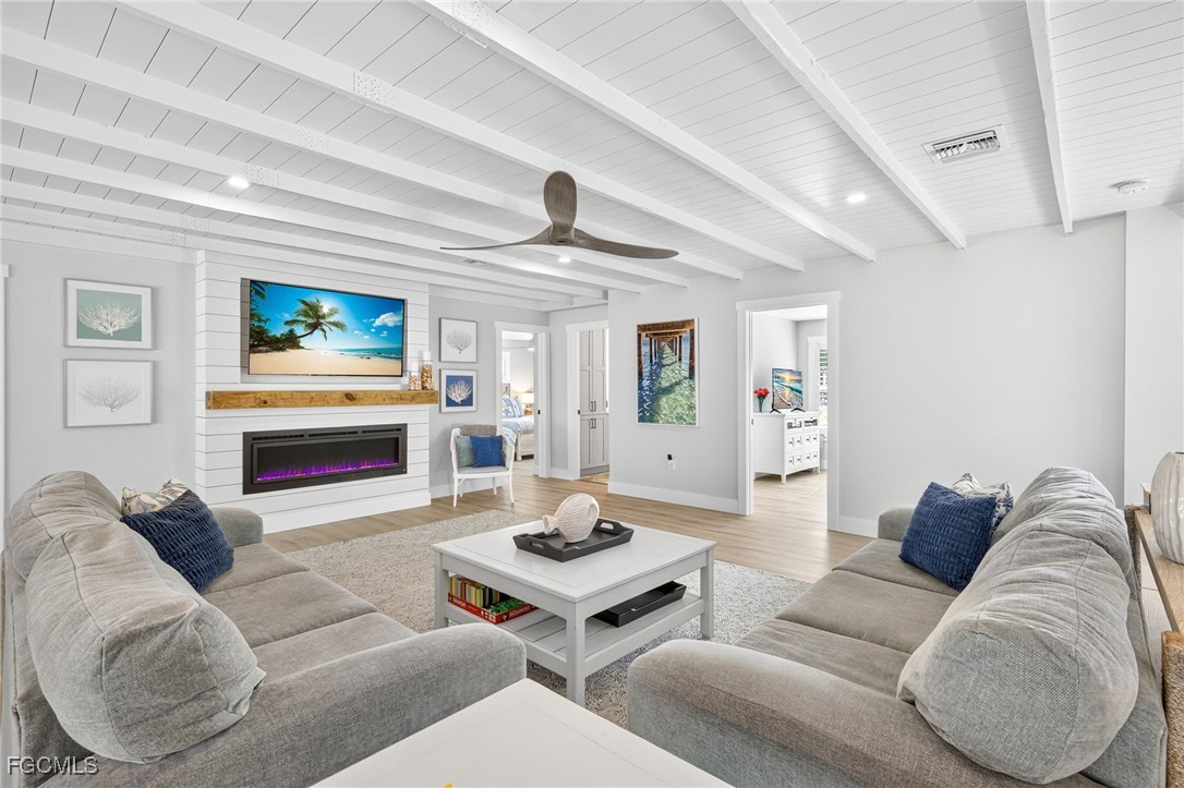 941 Pecten Court Sanibel, FL 33957 - Photo 7 of 44 a living room with furniture and a flat screen tv